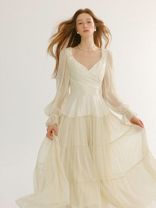 Woman wearing the Aileen V-neck long dress – elegant, feminine, and perfect for ceremony or formal occasions.