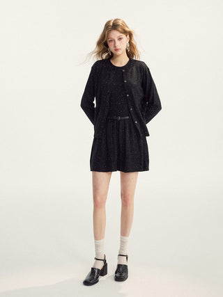 Woman wearing a confetti knit belted set for a spring casual look