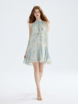 Romantic halterneck mini dress with shirred waist and flared skirt, perfect for summer styling