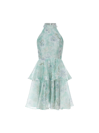 Emerald ruffle mini dress with shirred shoulders and flared hem, ideal for romantic vacation looks