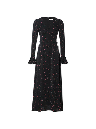 Model wearing the Evening Floral Long Dress, a V-neck long dress with flared sleeves, tie and hidden back zip, styled in a romantic and elegant evening look – SINCETHEN. 