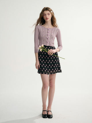 Woman wearing a grape ribbon knit cardigan – cozy, charming, and perfect for layering.