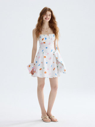 Mini dress with seashell neckline and ruffle details, ideal for vacation or resort styling