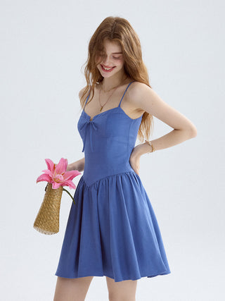 Indigo sleeveless mini dress with square neckline and flared hem, perfect for a breezy summer outfit