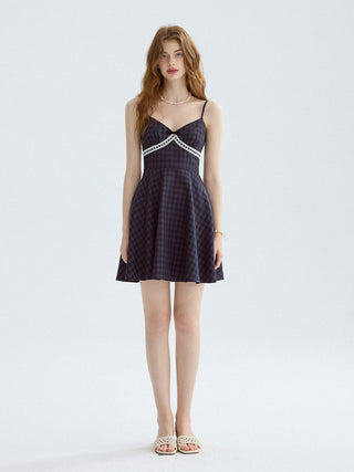 Gingham mini dress with sleeveless and flared hem, perfect for a romantic summer look