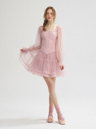 Model wearing the Mauve Lace Mini Dress with soft floral lace, a sweetheart neckline, and romantic ribbon details.