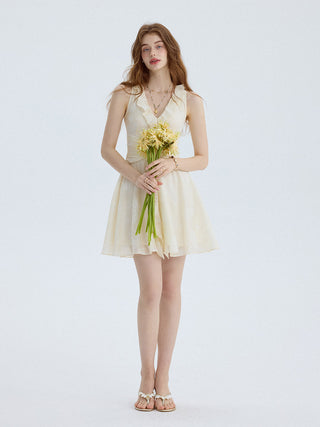 Mini dress with v neckline and layered ruffles, perfect for adding charm to everyday moments