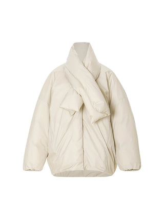 Model wearing the Plumpy Muffler Duck Down Jacket, a nylon duck down puffer with detachable matching scarf, zip front pockets and elastic cuffs for a warm winter look – SINCETHEN. 