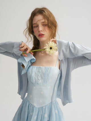 Model wearing the Punching Open Cardigan in blue, featuring a breathable eyelet knit and scalloped edges — perfect for layering over tops and dresses in spring and summer.