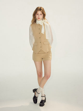 Close-up of the clean-cut hem and fabric texture of sandstone shorts