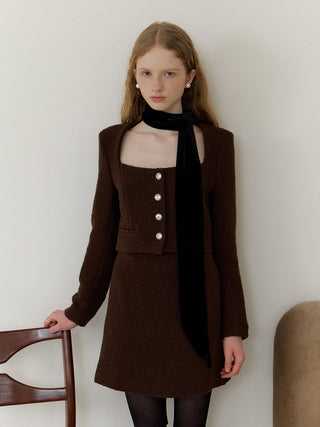 Square Neck Bouclé Set – square-neck bouclé jacket with padded shoulders and button front, matching mini skirt with side slits and hidden back zip