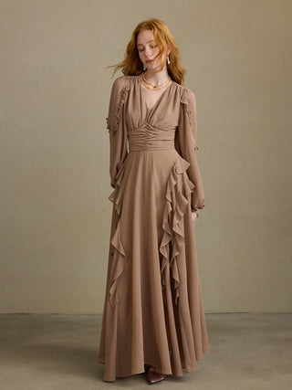 Model wearing the Truffle Ruffle Long Dress, a V-neck long dress with ruffle trim, ruched waist and long sleeves with elastic cuffs, styled for a romantic fall-winter look – SINCETHEN. 